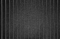 Distress grunge vector texture of knitted fabric, sweater, pullover, jersey with vertical stripes. Black and white background