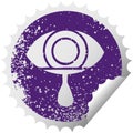 Distressed circular peeling sticker symbol crying eye