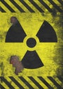 A distressed and corroded rusty metal nuclear radiation warning symbol using yellow and black colors