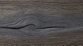 Distressed Dark Neutral Backdrop with Apparent Knot Detail Providing Rustic Texture and Character Royalty Free Stock Photo