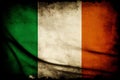 Distressed dark worn background of a vintage national flag of the Republic of Ireland Royalty Free Stock Photo