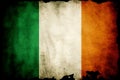 Distressed dark worn background of a vintage national flag of the Republic of Ireland Royalty Free Stock Photo