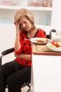 Distressed Disabled Senior Woman Making Sandwich Royalty Free Stock Photo
