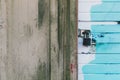 Distressed green mold wall with padlock blue white door background texture