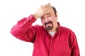 Distressed middle aged man with hand on forehead Royalty Free Stock Photo