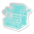 distressed old cartoon sticker of old school typewriter