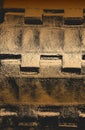 Distressed overlay texture of golden rusted peeled metal plate, tractor track, tank caterpillar tread. grunge background