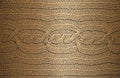 Distressed overlay texture of golden weaving fabric, ornamental knitted sweater, plait, jersey, pullover. grunge background Royalty Free Stock Photo