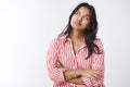 Distressed and pressured young impatient woman staring at upper left corner checking time cross arms over chest and Royalty Free Stock Photo