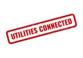 Distressed red rubber stamp effect confirming Utilities Connected text for property readiness and active services Royalty Free Stock Photo