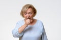 Distressed senior woman coughing