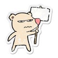 distressed sticker of a angry bear cartoon holding placard