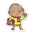 distressed sticker of a cartoon bald man with xmas gift Royalty Free Stock Photo