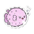 distressed sticker of a cartoon blowfish Royalty Free Stock Photo
