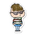 distressed sticker of a cartoon boy wearing sunglasses with stack of books Royalty Free Stock Photo