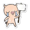 distressed sticker of a cartoon crying pig with sign post Royalty Free Stock Photo