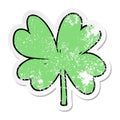 distressed sticker of a cartoon four leaf clover