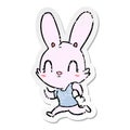 distressed sticker of a cute cartoon rabbit running Royalty Free Stock Photo