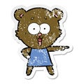 distressed sticker of a laughing pointing teddy bear cartoon