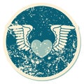 distressed sticker tattoo style icon of a heart with wings