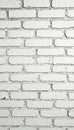 Distressed white brick wall with subtle shadow detail , backdrop, building, studio Royalty Free Stock Photo