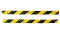 Distressed yellow and black barricade tape on white background with clipping path Royalty Free Stock Photo