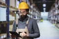 Distribution advisor counting merchandise boxes for new retail order Royalty Free Stock Photo