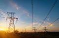 Distribution electric substation with power lines and transformers, at sunset Royalty Free Stock Photo