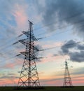 Distribution electric substation with power lines and transformers, at sunset Royalty Free Stock Photo