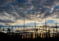 Distribution electric substation, pylon with lines, at sunset Royalty Free Stock Photo