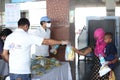 Distribution of food items and water at railway station to Indian migrant laborers leaving the city due to covid-19 pandemic.