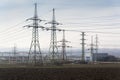 Distribution power station with electricity pylons and dramatic cloudy sky Royalty Free Stock Photo