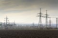 Distribution power station with electricity pylons and dramatic cloudy sky Royalty Free Stock Photo