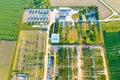 Distribution substation in the middle of the field, power plant and many power lines. Aerial view Royalty Free Stock Photo