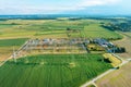 Distribution substation in the middle of the field, power plant and many power lines. Aerial view Royalty Free Stock Photo