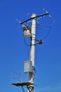 Distribution transformer on concrete power pole Royalty Free Stock Photo