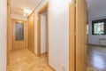 Distributor corridor of a house with French oak parquet flooring placed in a herringbone pattern, built-in wardrobe doors and