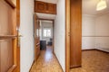 Distributor corridor of a house with glossy oak wood floors, access to other rooms with sapele wood doors and mezzanines of the Royalty Free Stock Photo