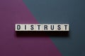 Distrust - word concept on cubes