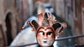 An ancient carnival mask in the Jewish quarter in Venice Royalty Free Stock Photo