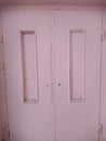 disturbing old and pink wooden door close up photo Royalty Free Stock Photo