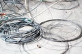 Disused discarded ruined abandoned LAN cable wires roll circle rope on the floor renovation decoration refurbish garbage trash