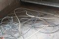 Disused discarded ruined abandoned LAN cable wires roll circle rope on the floor renovation decoration refurbish garbage trash