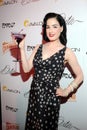 Dita Von Teese appearing live.