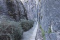 Ditch full of water between mountain walls on the route of the river Monachil, in Los Cahorros, Granada,