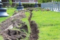 Ditch in the ground dug for cable laying in the city. Royalty Free Stock Photo