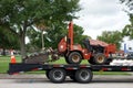 A ditch witch being transported