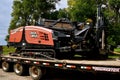 Ditch Witch Trencher loader on a flat bed trailer