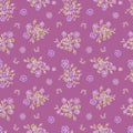 Ditsy floral seamless pattern on purple background. Hand drawn vintage backdrop with tiny flower bouquets. Cottage core Royalty Free Stock Photo