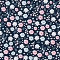 Ditsy floral seamless pattern in vector. Cute pink and blue flowers on dark background. Royalty Free Stock Photo